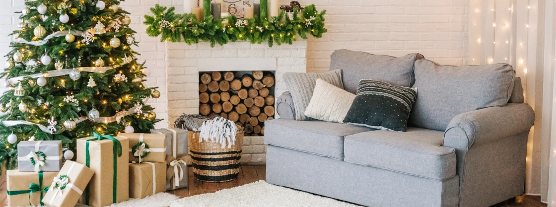 Couple Cleaning Holiday Themed Living Room.