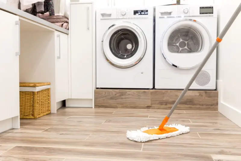 Mop in laundry room.