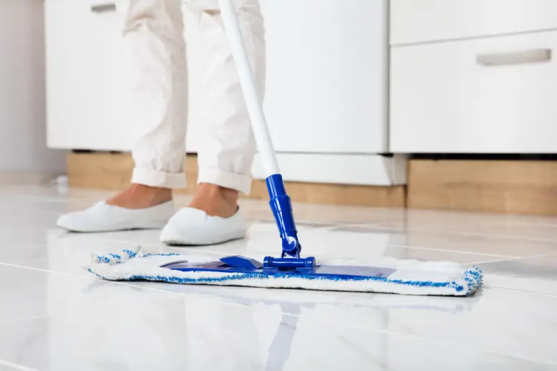 Person mopping floor.