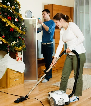 woman mopping a wood floor.