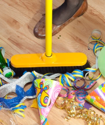 sweeping mess off floor after a party.