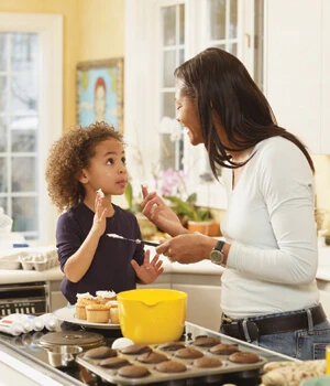 Mother and child baking in the kitchen.