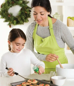 Mother and daughter cooking a holiday dinner.