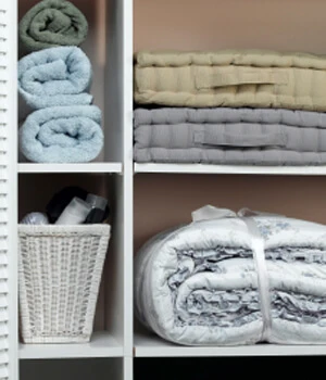 towels organized on bathroom shelves.