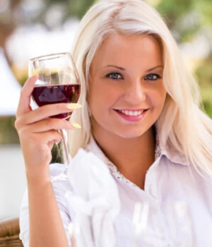 woman holding a glass of red wine.