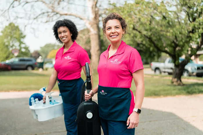 Molly Maid professionals headed to an eco-friendly cleaning appointment