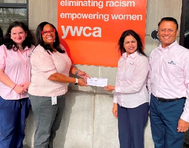 Molly Maid employees presenting YWCA check.