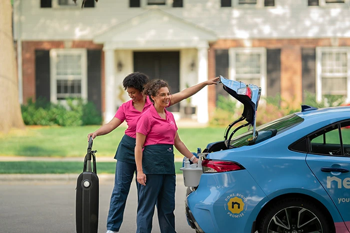 Molly Maid professionals arriving for a move-out cleaning.