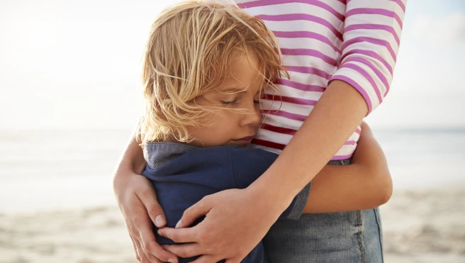 Son hugging his mother.