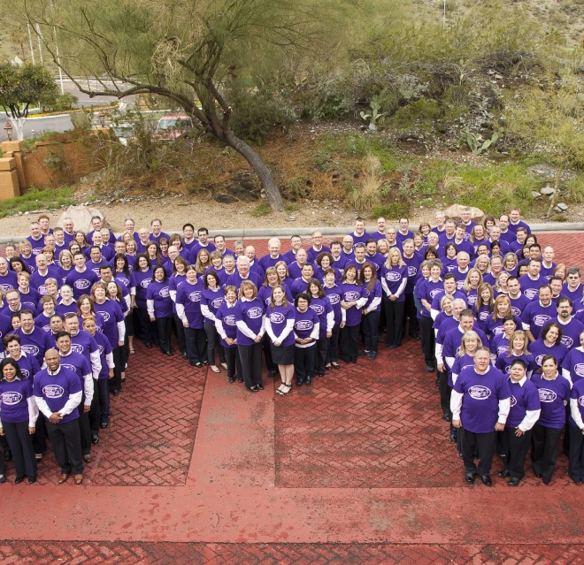 Ms. Molly employees standing in a M shape.