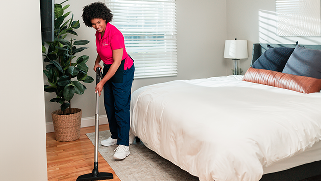 Maid providing a home cleaning service.