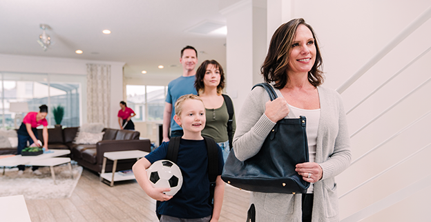 A busy family leaving while Molly Maid cleans.