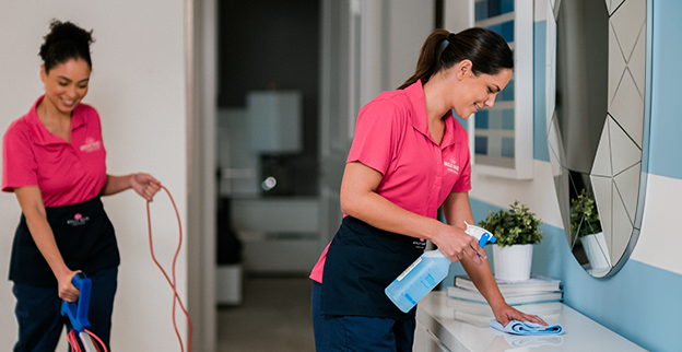 Molly Maid employee providing a recurring cleaning service each week. 