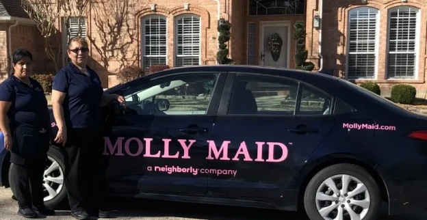 Molly Maid house cleaners standing outside of home in Flower Mound, TX.