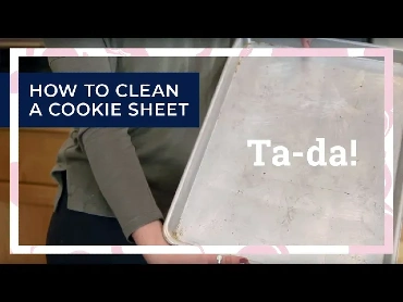 A person holding a clean cookie sheet, overlaid with the words Ta-da! and How to Clean a Cookie Sheet.