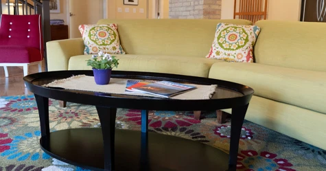 Beige couch and black coffee table