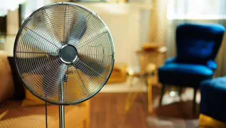 Closeup on clean floor standing fan.