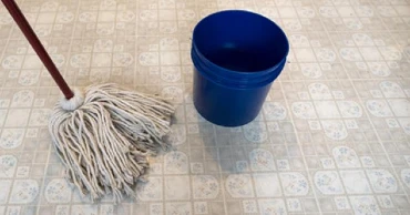 mop on linoleum floor