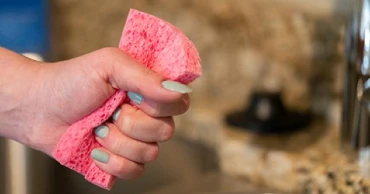 pink sponge being wrung out.