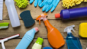 House cleaning products in a wood table