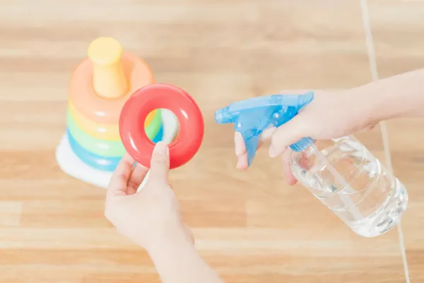 Mom disinfecting baby toys