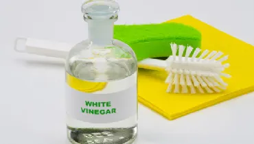 Vinegar and cleaning tools.