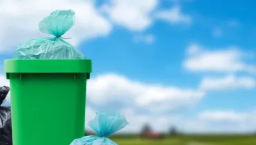 Garbage bags and waste bin outside