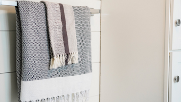 Turkish towels hanging on bathroom towel rack.