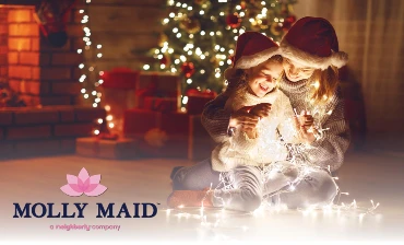 Mother and Daughter in Front of Holiday Tree with Lights